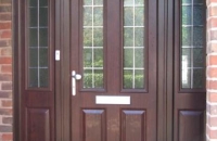 upvc panelled rosewood front-door and sidelights