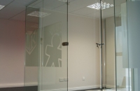 Frameless glass partition and doors